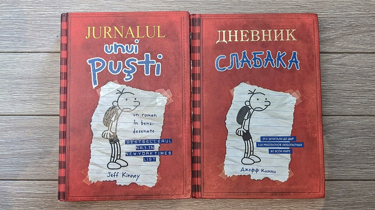 two books side by side, one in Russian and one in Romanian